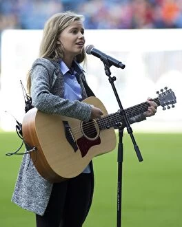 Football Action Armed Forces Collection: Megan Adams Sings the National Anthem at Rangers Ibrox Stadium: Ladbrokes Premiership Match
