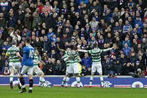 Soccer Football Action Old Firm Derby Glasgow Collection: Moussa Dembele's Celebrated Goal Against Rangers in Ibrox Stadium