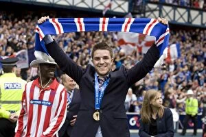 Football Celebrations Collection: Rangers Football Club: Andrew Little's Triumphant Moment - Celebrating the SPL Championship Win