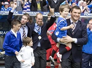 Football Celebrations Collection: Rangers Football Club: Euphoric Celebration of SPL Championship Win by Kirk Broadfoot