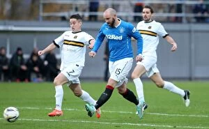 Football Action Scottish Cup Collection: Rangers Kris Boyd Chases Scottish Cup Glory: Showdown vs. Dumbarton at The Bet Butler Stadium