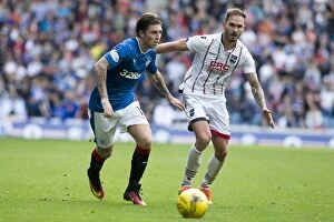 Football Action Armed Forces Collection: Rangers vs Ross County: Clash at Ibrox Stadium - Ladbrokes Premiership Showdown