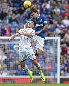 Football Action Armed Forces Collection: Windass vs Routis: Intense Clash Between Rangers Josh Windass