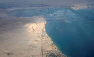 An aerial view of the coast of the Red Sea is pictured through the window of an airplane An aerial view of the coast of the Red Sea is pictured through the window of an airplane