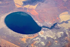 An aerial view of a large lake surrounded by agricultural farming land in south-western An aerial view of a large lake surrounded by agricultural farming land in south-western