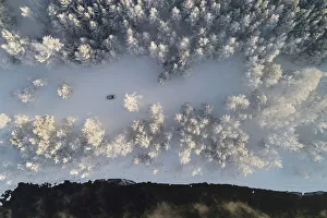 An aerial view shows a car driving along a bank of the Yenisei River outside Krasnoyarsk An aerial view shows a car driving along a bank of the Yenisei River outside Krasnoyarsk
