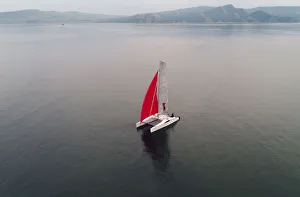 Russia Gallery: Aerial view shows a couple traveling on a sailing catamaran along the Yenisei River