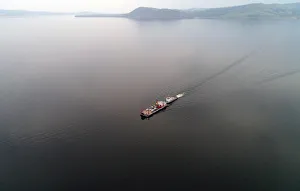 Russia Gallery: Aerial view shows a ferry transporting passengers and vehicles across the Yenisei