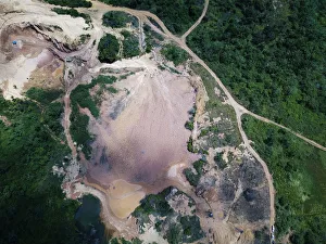 An aerial view shows the location of an illegal gold mine as its machines are destroyed An aerial view shows the location of an illegal gold mine as its machines are destroyed