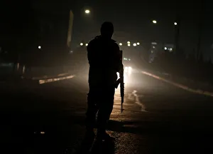 An Afghan policeman keeps watch near the site of an attack on the Intercontinental Hotel An Afghan policeman keeps watch near the site of an attack on the Intercontinental Hotel