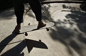 An Afghan youth prepares to ride a skateboard in a disused fountain in a Kabul park An Afghan youth prepares to ride a skateboard in a disused fountain in a Kabul park