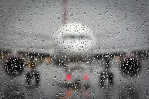 Airplane is pictured though a rain-coated window on the day before Christmas at LaGuardia Airplane is pictured though a rain-coated window on the day before Christmas at LaGuardia