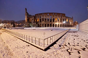 Ancient Roman Gallery: The ancient Colosseum is seen during a heavy snowfall early in the morning in Rome