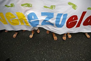 Anti-government protesters march barefooted during a protest in Caracas Anti-government protesters march barefooted during a protest in Caracas