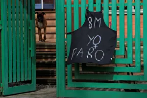 An apron hanging at the entrance of a private home says March 8 An apron hanging at the entrance of a private home says March 8
