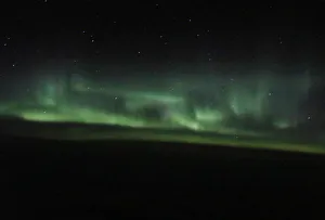 The Aurora Borealis is visible from a plane at 37,000 feet above the Labrador Sea The Aurora Borealis is visible from a plane at 37,000 feet above the Labrador Sea