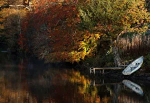 Autumnal foliage is reflected on Loch Faskally, Pitlochry, Scotland Autumnal foliage is reflected on Loch Faskally, Pitlochry, Scotland