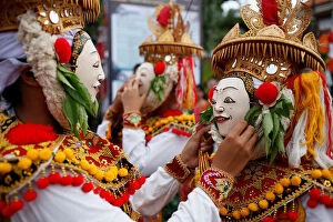 Indonesia Gallery: Balinese Hindus wear masks as they prepare before performing sacred Telek dance at