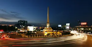 Bangkoks Victory Monument is seen lit as cars go past its roundabout Bangkoks Victory Monument is seen lit as cars go past its roundabout