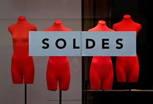A banner reading Sales is seen on a clothing stores front window during the start of A banner reading Sales is seen on a clothing stores front window during the start of