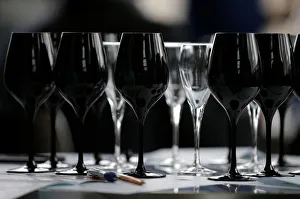 Black glasses specially designed for wine blind testing are seen on a table during the Black glasses specially designed for wine blind testing are seen on a table during the
