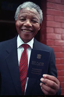 Black nationalist leader Nelson Mandela shows his passport Black nationalist leader Nelson Mandela shows his passport