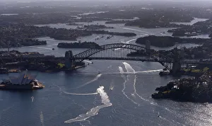Boats navigate next to the Sydney Opera House and the Harbour Bridge on a sunny winter Boats navigate next to the Sydney Opera House and the Harbour Bridge on a sunny winter