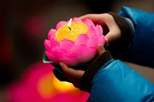 A boy holds a candle to pray at a Buddhist temple in Badachu park during Spring Festival A boy holds a candle to pray at a Buddhist temple in Badachu park during Spring Festival