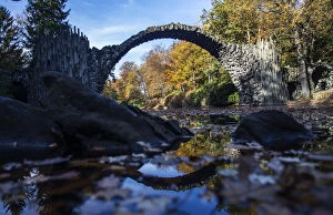 Images Dated 4th November 2014: The Bridge Rakotzbr?cke is pictured against trees in autumn colours in the the eastern