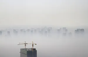 A building under construction is seen amidst smog on a polluted day in Shenyang A building under construction is seen amidst smog on a polluted day in Shenyang