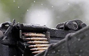 Bullets are pictured on a machine gun as armed forces members patrol during an operation Bullets are pictured on a machine gun as armed forces members patrol during an operation
