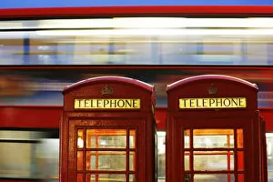 Images Dated 3rd November 2013: A bus passes traditional telephone boxes in London