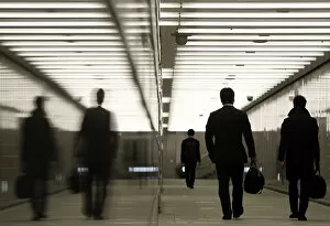 Images Dated 11th January 2011: Businessmen walk through a business complex in Tokyo