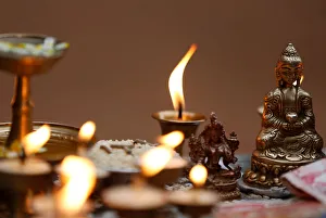 Butter lamps are offered near the idol of Buddha during Vesak Day at Boudhanath Stupa in Butter lamps are offered near the idol of Buddha during Vesak Day at Boudhanath Stupa in
