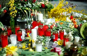 Candles and flowers are placed at the site where, on April 7 Candles and flowers are placed at the site where, on April 7