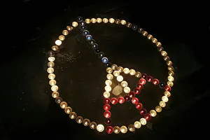 Candles are laid on the Republique square in the shape of the Eiffel tower Candles are laid on the Republique square in the shape of the Eiffel tower