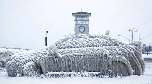 A car covered with ice remains stranded on the waterfront in Hamburg, New York A car covered with ice remains stranded on the waterfront in Hamburg, New York