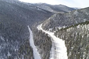A car drives along the R257 federal highway in the Western Sayan Mountains in Krasnoyarsk A car drives along the R257 federal highway in the Western Sayan Mountains in Krasnoyarsk