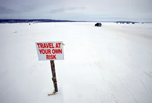 Car travels the ice road on Lake Superior between Bayfield, Wisconsin and Madeline Island Car travels the ice road on Lake Superior between Bayfield, Wisconsin and Madeline Island