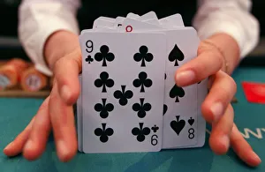 A card dealer adjusts cards at the Paradise Walker-hill casino in Seoul A card dealer adjusts cards at the Paradise Walker-hill casino in Seoul