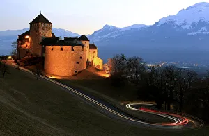 Cars drive past Vaduz Castle in Liechtensteins capital Vaduz Cars drive past Vaduz Castle in Liechtensteins capital Vaduz