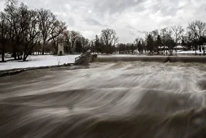 Images Dated 24th November 2014: Cayuga Creek water rushes past a neighbourhood following a massive snow storm in