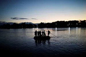 Central American migrants cross the Suchiate river into Mexico on a raft as they try to Central American migrants cross the Suchiate river into Mexico on a raft as they try to