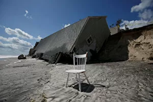 Images Dated 13th September 2017: A chair is pictured outside a collapsed coastal house after Hurricane Irma passed the