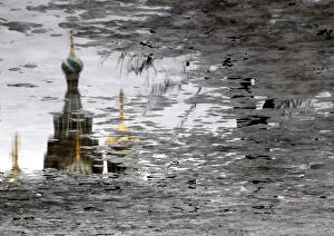 Images Dated 20th March 2012: The Church of the Savior on Spilled Blood is reflected in melting ice on Arts Square in