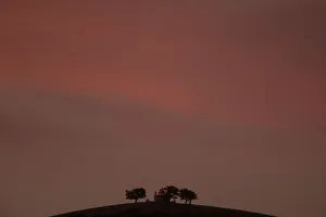A church is seen atop a mountain during sunset near the town of Kalavrita A church is seen atop a mountain during sunset near the town of Kalavrita