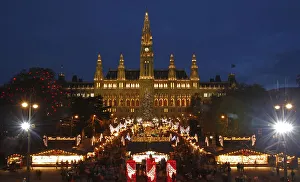 The city hall is pictured behind Christkindlmarkt advent market in Vienna The city hall is pictured behind Christkindlmarkt advent market in Vienna