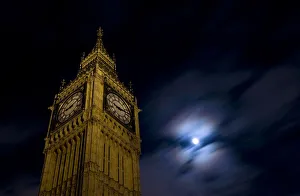 The clock tower at the Houses of Parliament is pictured beneath the moon in London The clock tower at the Houses of Parliament is pictured beneath the moon in London
