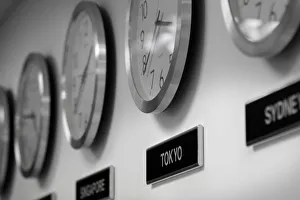 Clocks are seen on the wall of an office in Singapore Clocks are seen on the wall of an office in Singapore