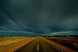 Images Dated 19th April 2004: CLOUDS GATHER OVER PETERMANN ROAD IN CENTRAL AUSTRALIA